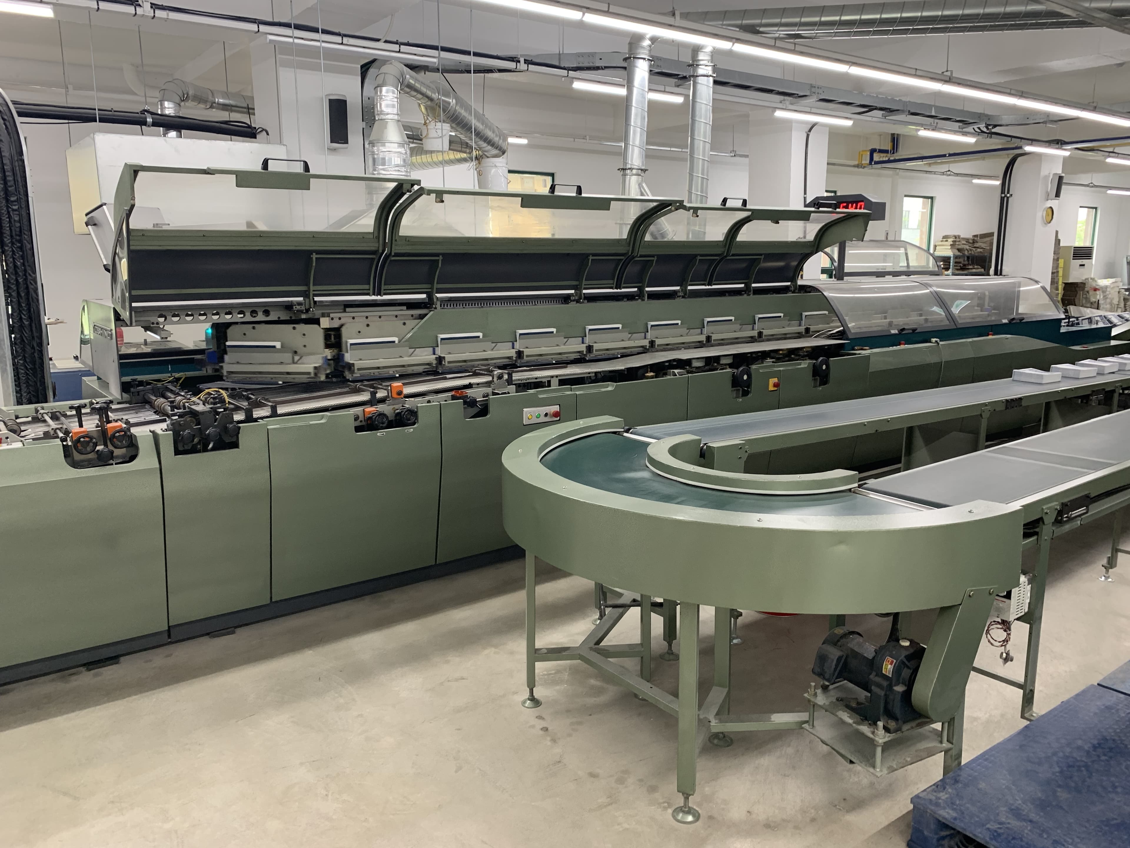 Close-up of the automated binding line in operation