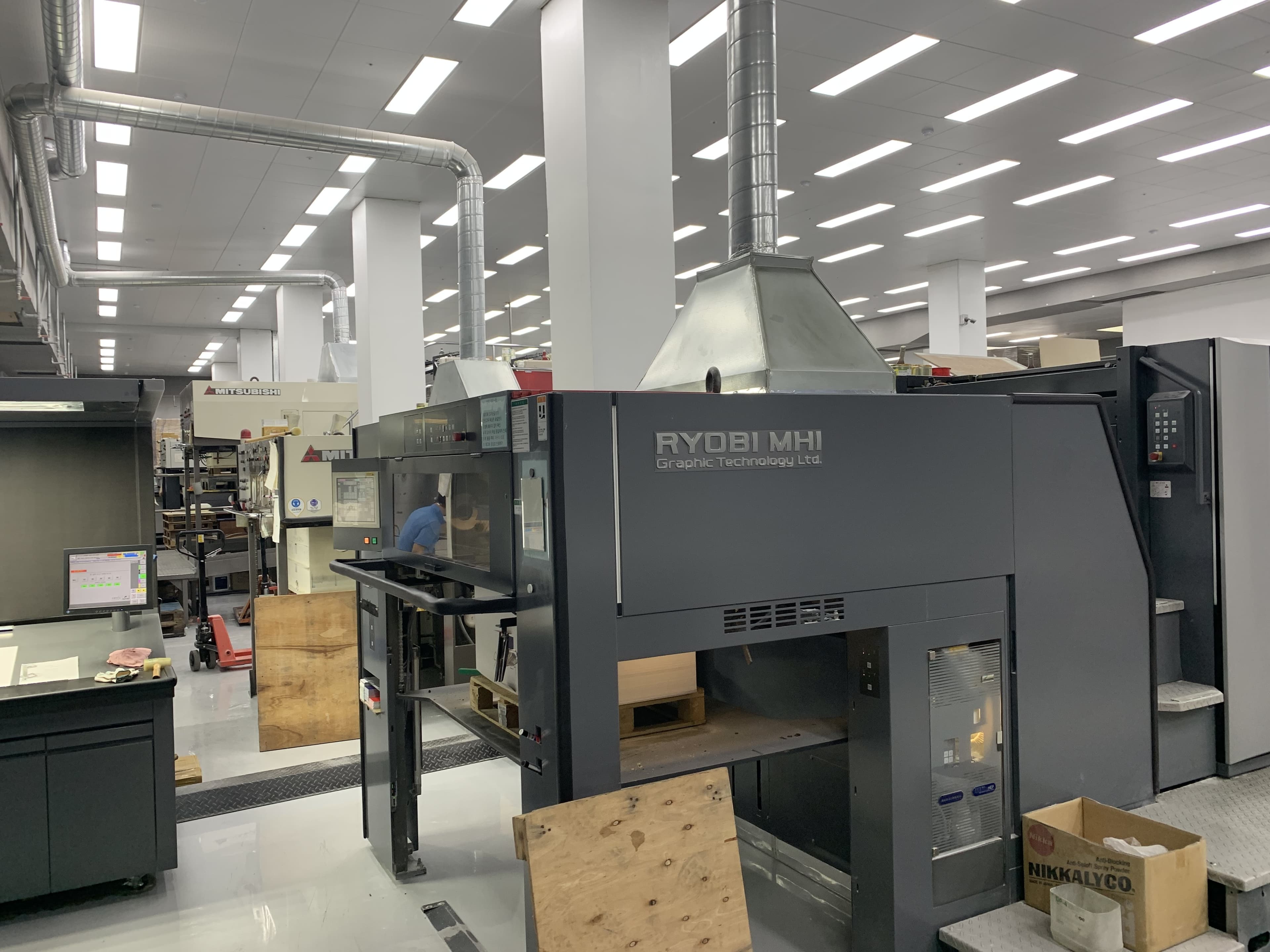 Close-up of offset press equipment and ink supply